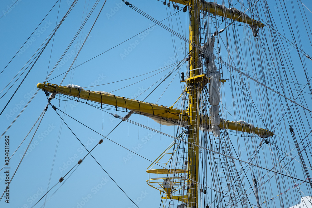 Masts of sailing ships against the blue sky. Masts of sailing ships against the blue sky.