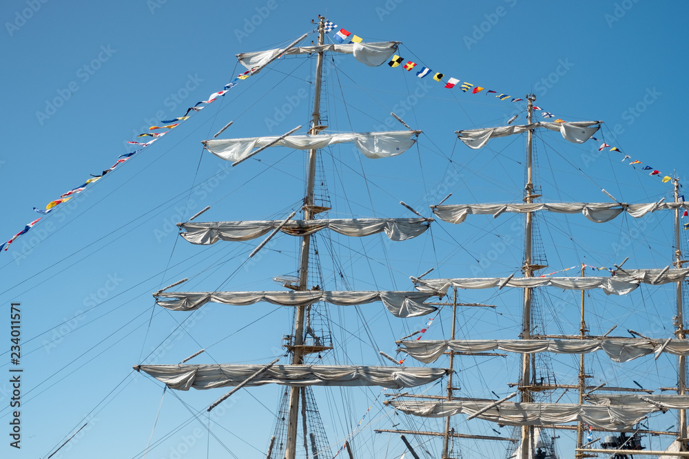 Masts of sailing ships against the blue sky. Masts of sailing ships against the blue sky.