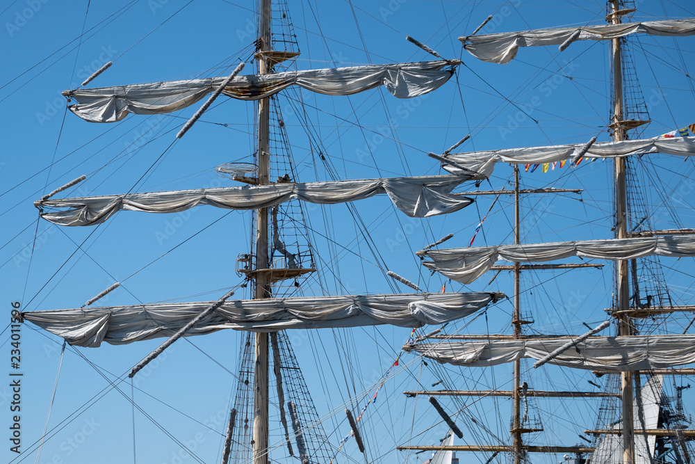 Masts of sailing ships against the blue sky. Masts of sailing ships against the blue sky.