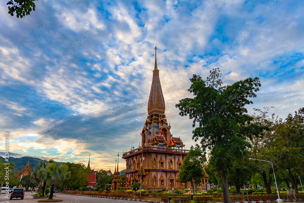 Fototapeta premium sunset on pagoda of Chalong temple.Wat Chalong is the largest and most revered in Phuket..all tourists like to visit Chalong temple.The beautiful temple complex was built in Thai East style..
