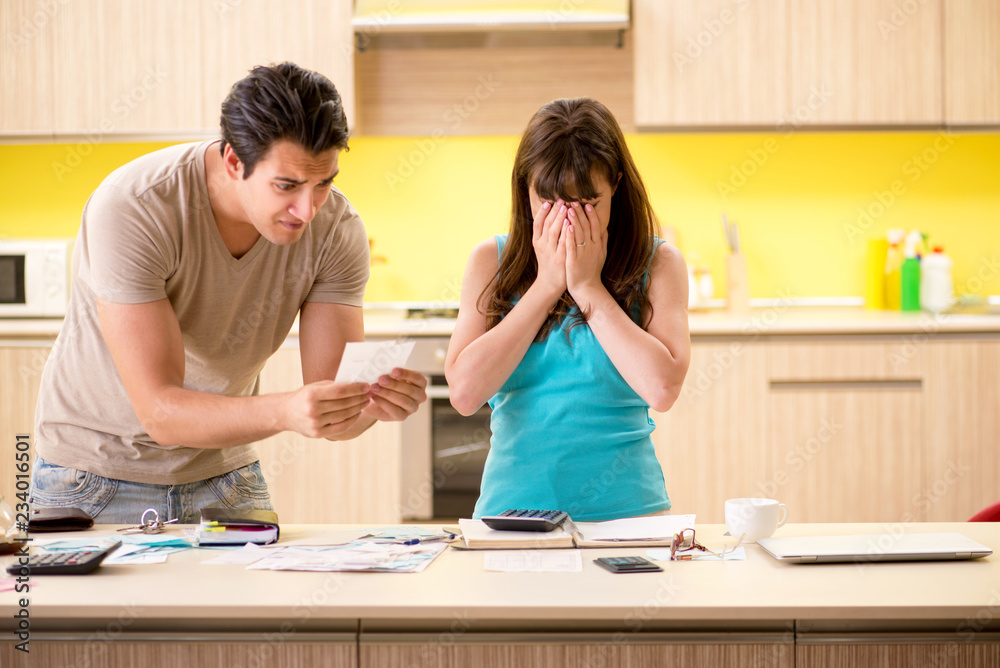 Fototapeta premium Young family struggling with personal finance