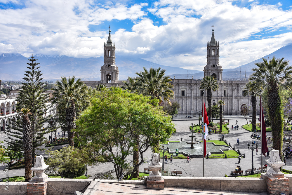 Arequipa, Peru - October 7, 2018: The Plaza de Armas and Arequipa Cathedral with the backdrop of El Misti volcano