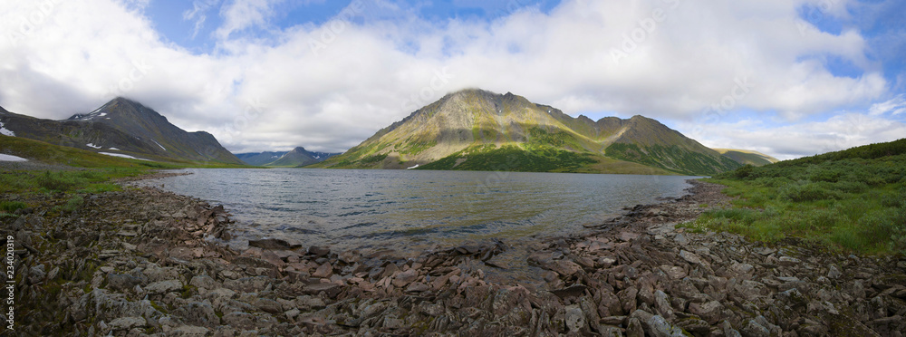 Panorama of the Big Hadatayoganlor lake on a cloudy August day. Yampal, Russia