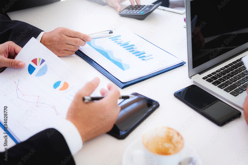 Businessman showing report graphs and charts of startup project with finance manager at the office. Businessman showing report graphs and charts of startup project with finance manager at the office.