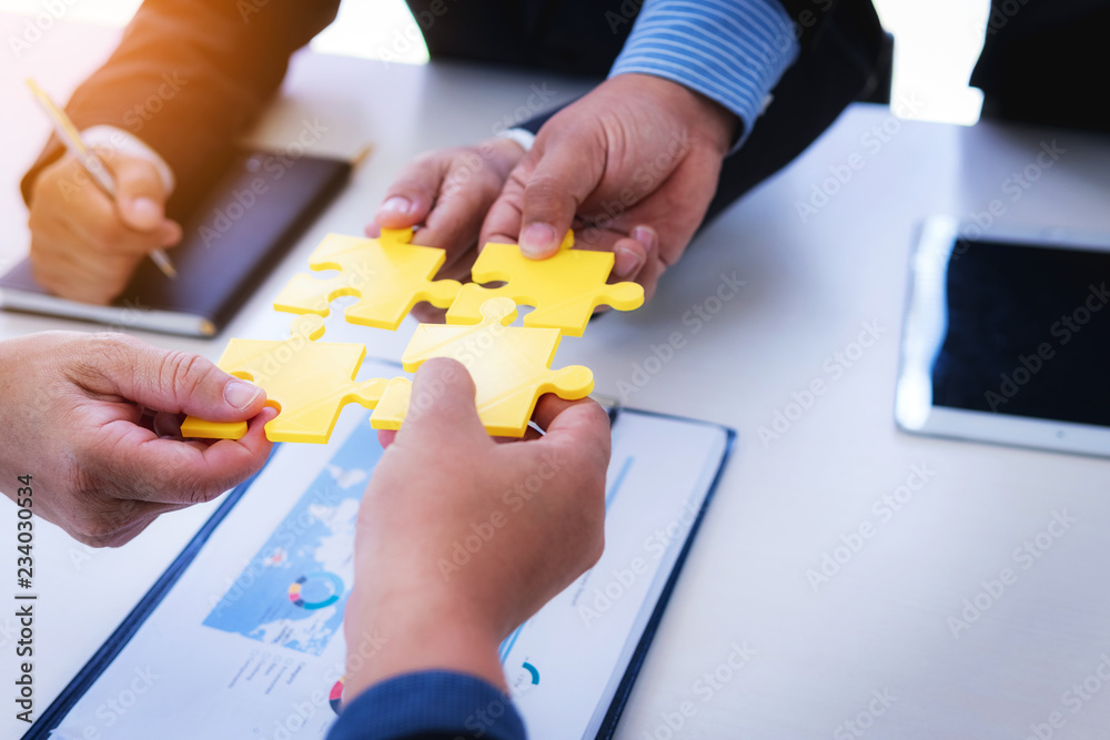 custom made wallpaper toronto digitalClose up of hands business women connecting jigsaw puzzleon office with tablet and graph financial diagram. Teamwork workplace success and strategy concept.
