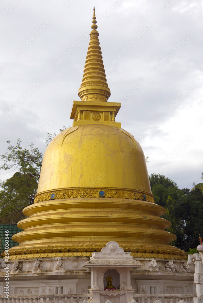 Stupa of the Golden Temple close-up on a gloomy day. Dambulla, Sri Lanka