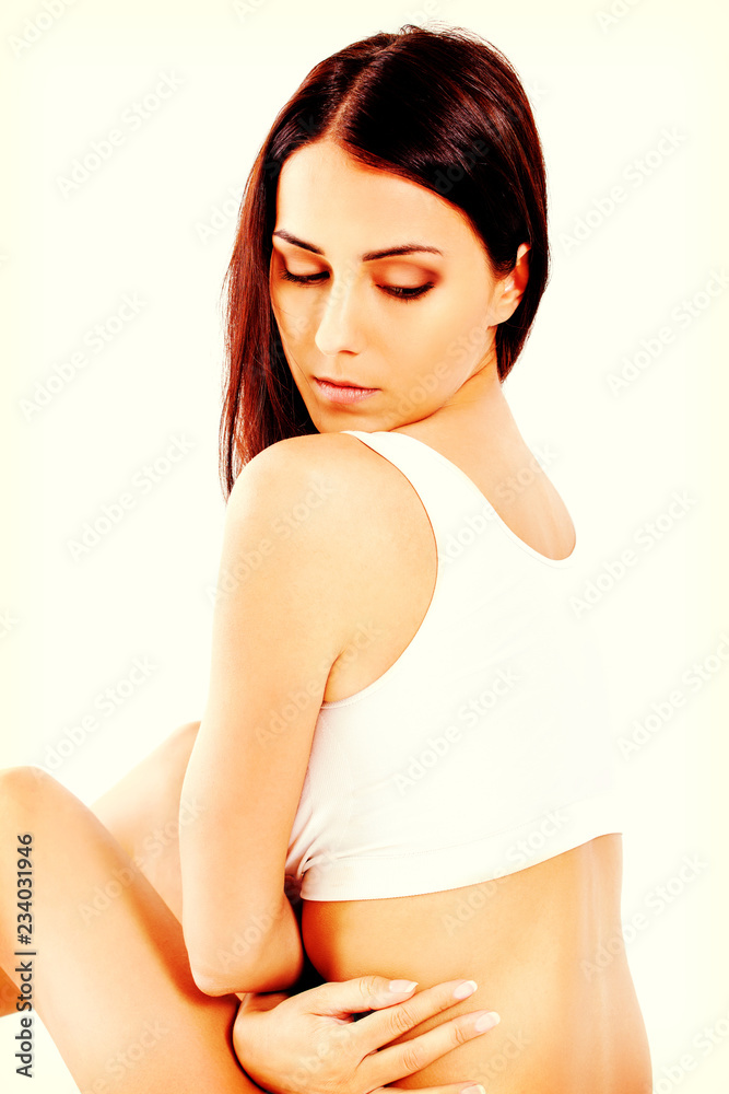 Portrait of beautiful fit girl in bra. Isolated on white. Portrait of beautiful fit girl in bra. Isolated on white.