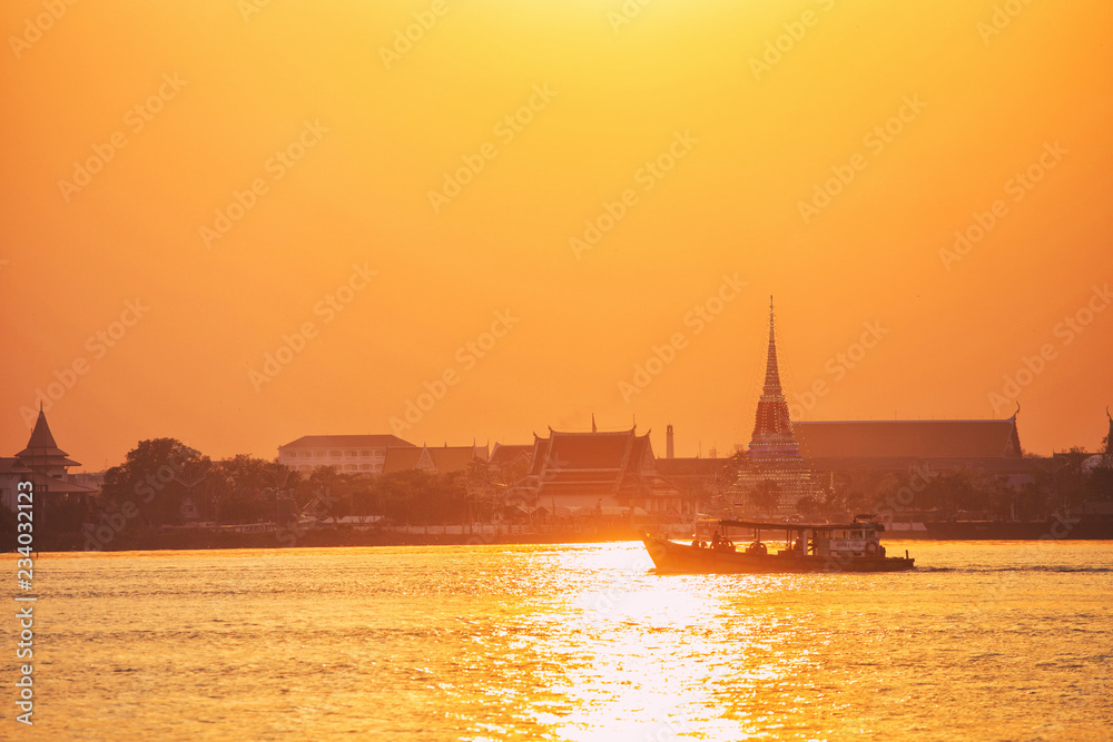 Wat Phra Samut Chedi on the river Chao Phraya. at sunset In Samut Prakan Province, Thailand.