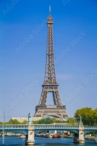 View of the famous Eiffel Tower in Paris France on a summer day with a clear blue sky with the Pont de Rouelle in the foreground and the iconic Eiffel Tower in the background