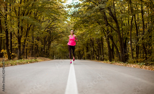 Young fitness woman running...