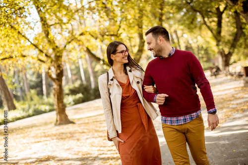 Young woman and man walking...