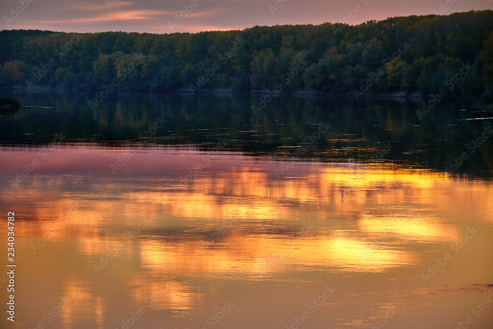 autumn landscape - forest and beautiful trees near the river, bright sunlight at sunset, fall season autumn landscape - forest and beautiful trees near the river, bright sunlight at sunset, fall season