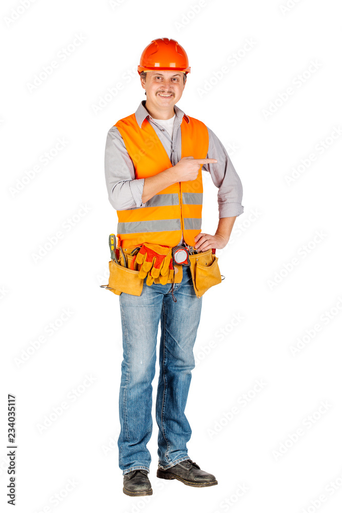Portrait of a male builder in a helmet looking at camera over white wall background. repair, construction, building, people and maintenance concept. Portrait of a male builder in a helmet looking at camera over white wall background. repair, construction, building, people and maintenance concept.