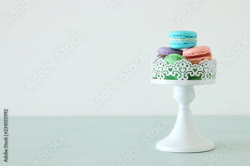 Image of colorful macaron or macaroon over pastel background.
