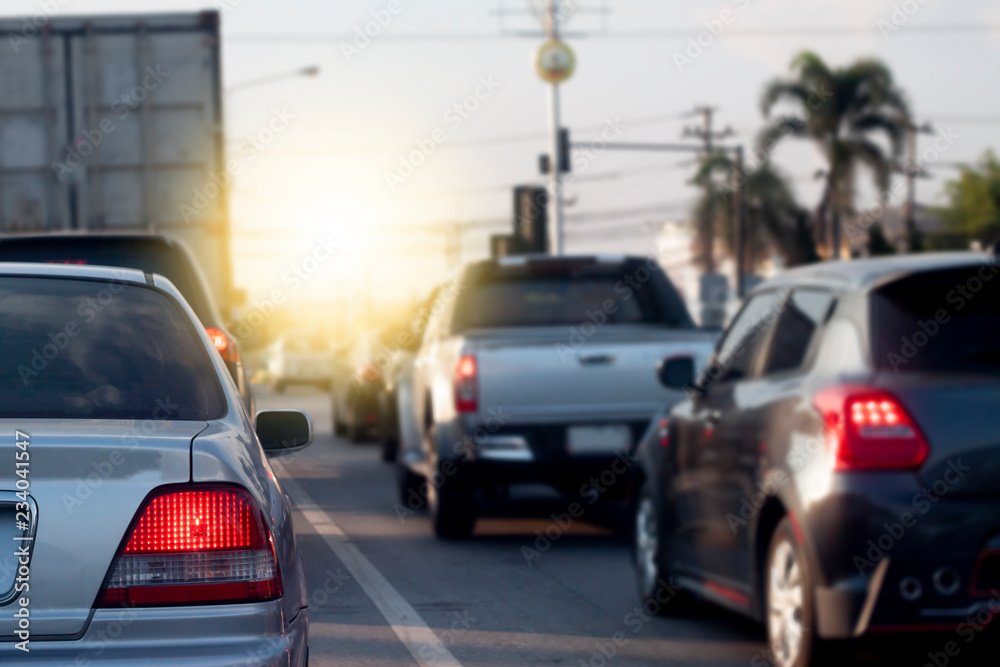 Cars break on the road by traffic jam in crossroad on day.