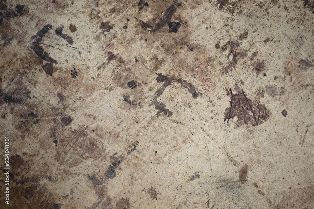 Dark brown spots on the surface of beige cardboard. Dark brown spots on the surface of beige cardboard.