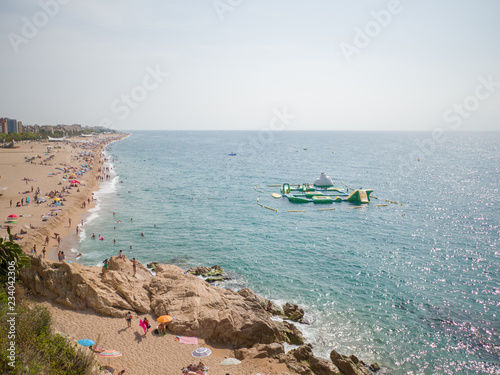 People at beach in Calella city. Spain. photo