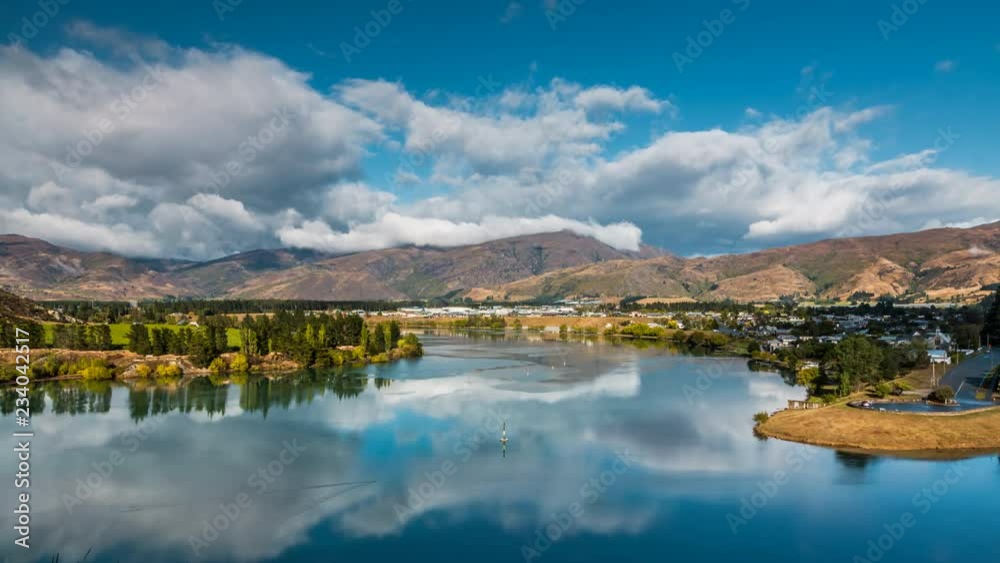 Beautiful dramatic clouds flying above mountains in Central Otago region in New Zealand. Scenic town of Cromwell in the view. Timelapse video. Beautiful dramatic clouds flying above mountains in Central Otago region in New Zealand. Scenic town of Cromwell in the view. Timelapse video.