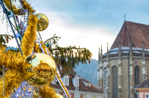 Golden globe with the reflection of the City Hall building and the Black Church.