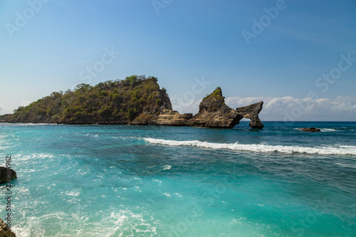 Magnificent view of unique natural rocks and cliffs formation in beautiful beach known as Atuh Beach located in the east side of Nusa Penida Island  Bali  Indonesia.