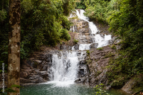 A multi level waterfall and cascade in a tropical rainforest