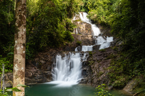 Long exposure of a beautiful waterfall running through tropical rainforest (Lampi, Thailand)
