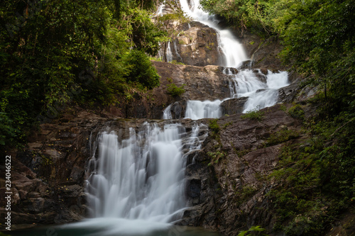 Long exposure of a beautiful waterfall running through tropical rainforest (Lampi, Thailand)