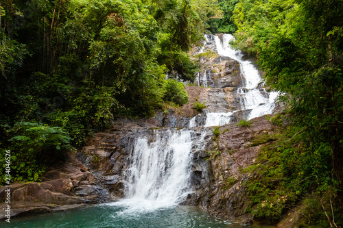 Fototapeta Naklejka Na Ścianę i Meble -  A multi level waterfall and cascade in a tropical rainforest