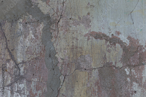 Old plaster walls with remnants of paint. Grunge texture.