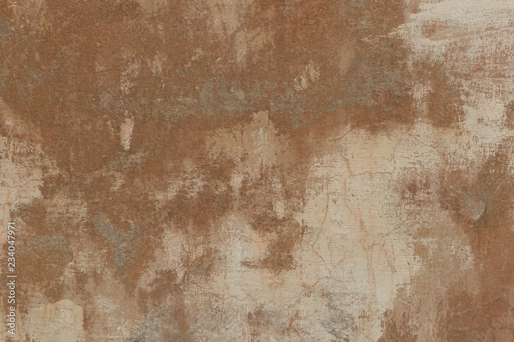 Fototapeta premium Old plaster walls with remnants of brown paint. Grunge texture.