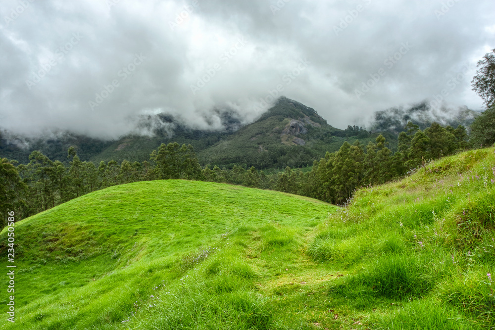 Cloudy skies in the mountains near Munnar, Kerala, India. Cloudy skies in the mountains near Munnar, Kerala, India.