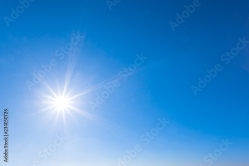 sparkle sun on a blue sky, natural background