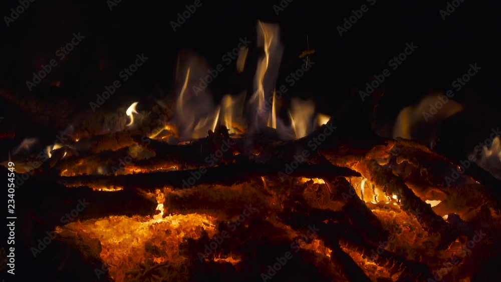 Fire on bonfire red-hot coals close up. 4K UHD video footage Fire on bonfire red-hot coals close up. 4K UHD video footage