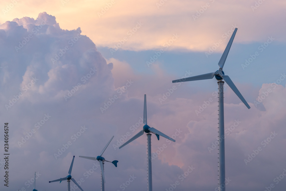 Obraz premium Wind turbine power generator at twilight