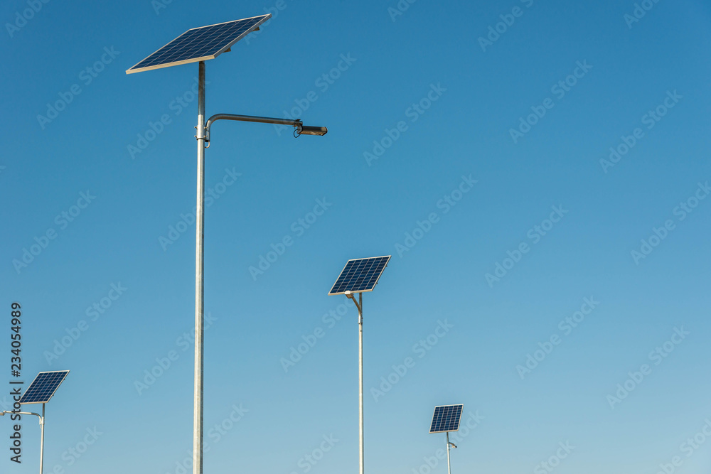 Solar photovoltaic panels close up shot on a sunny day, blue sky background. Solar photovoltaic panels close up shot on a sunny day, blue sky background.