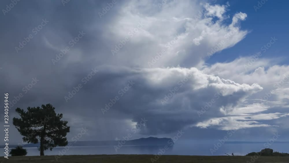 Dramatic clouds and heavy rain coming to a beautiful blue lake. Lake Taupo, New Zealand. Timelapse video Dramatic clouds and heavy rain coming to a beautiful blue lake. Lake Taupo, New Zealand. Timelapse video