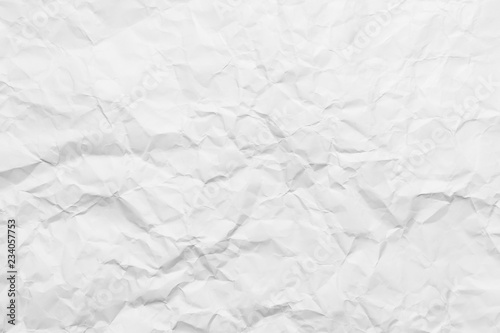 Background of a crumpled white sheet of a paper.