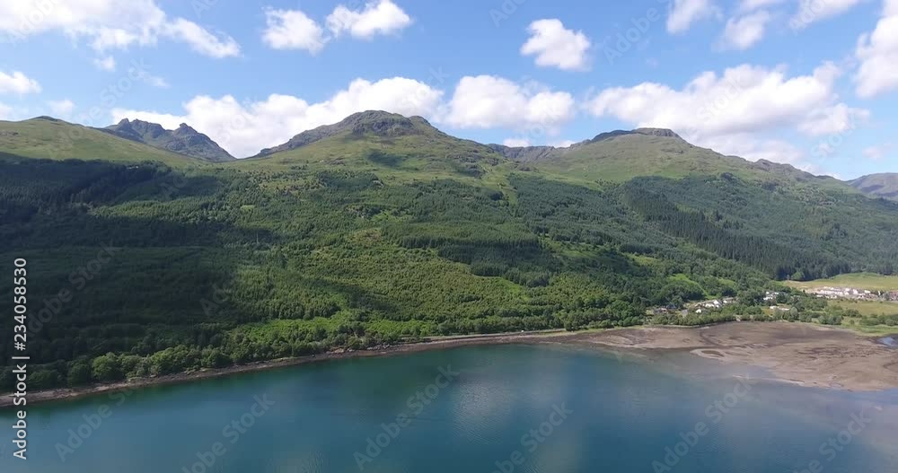 Blue Green Lake Drone Shot with Forested Landscape in Scotland - Aerial View Loch Fyne in the Highlands Blue Green Lake Drone Shot with Forested Landscape in Scotland - Aerial View Loch Fyne in the Highlands