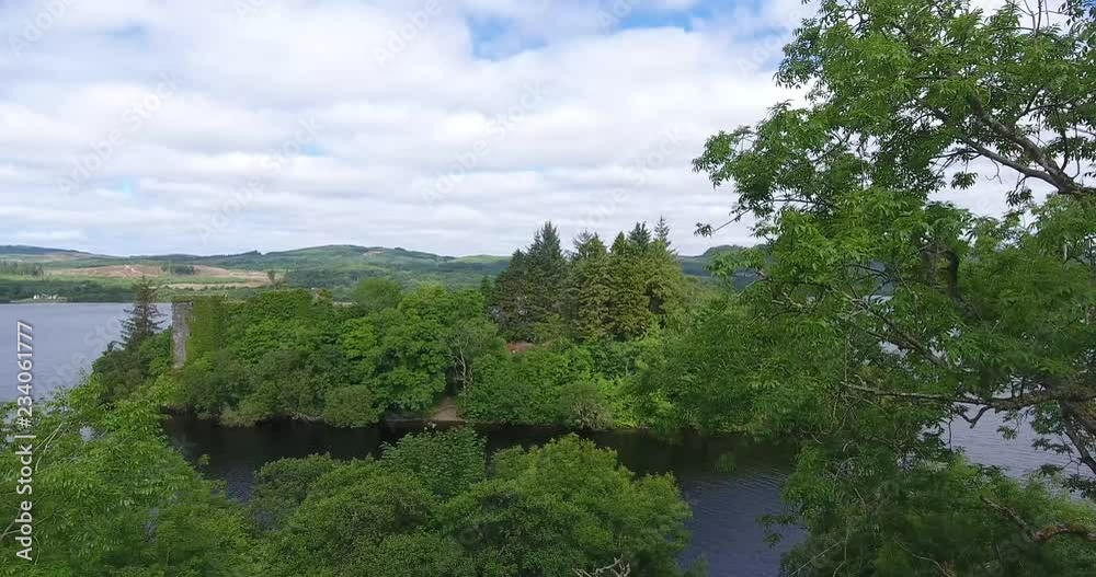 Slow Drone Shot of a Scottish Forest with Sunlight Breaking Through Slow Drone Shot of a Scottish Forest with Sunlight Breaking Through