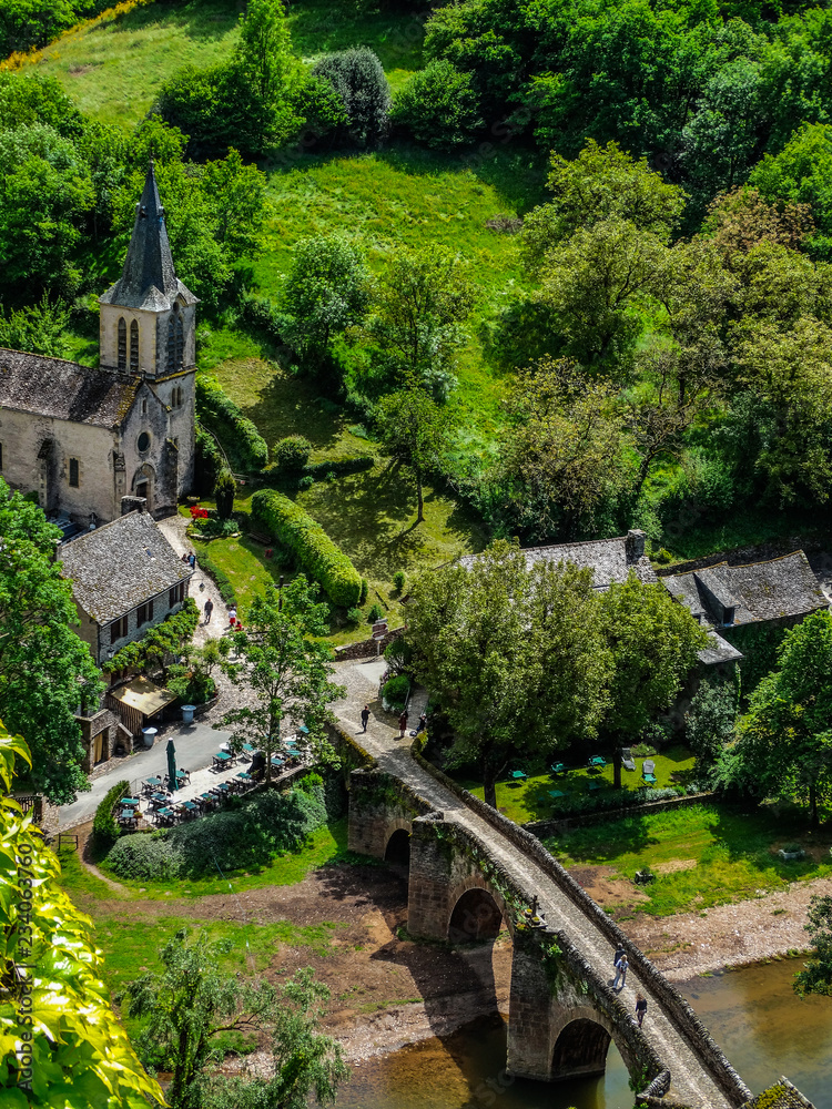 Belcastel medieval village, with church and bridge over the Aveyron river, Aveyron, France