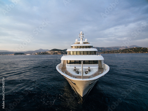 stunning bow view of white motor yacht