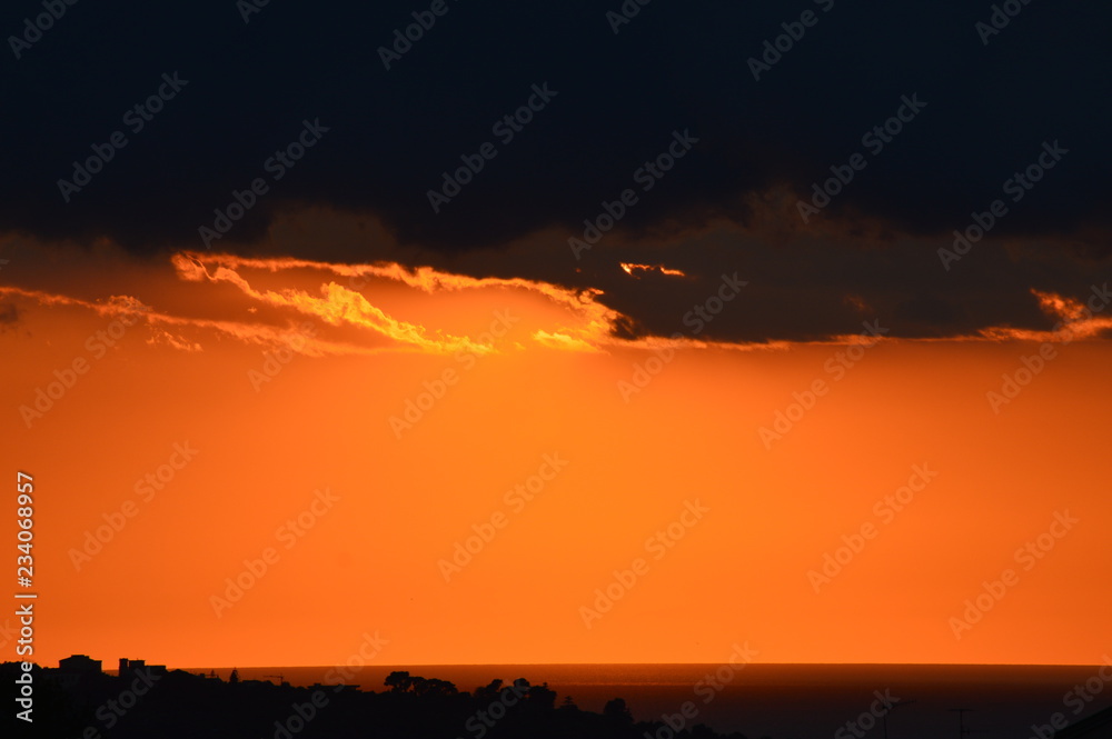 Fototapeta premium Tramonto, estate e nuvole