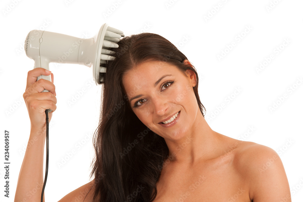 Beautiful young woman drying hair with hair dryer isolated over white background Beautiful young woman drying hair with hair dryer isolated over white background