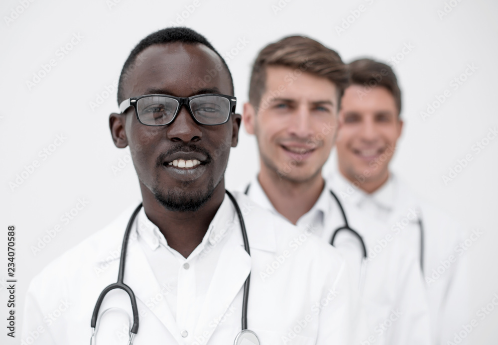 group of multi-racial doctors standing in a row