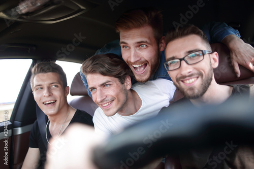 Friends renting a car and driving somewhere