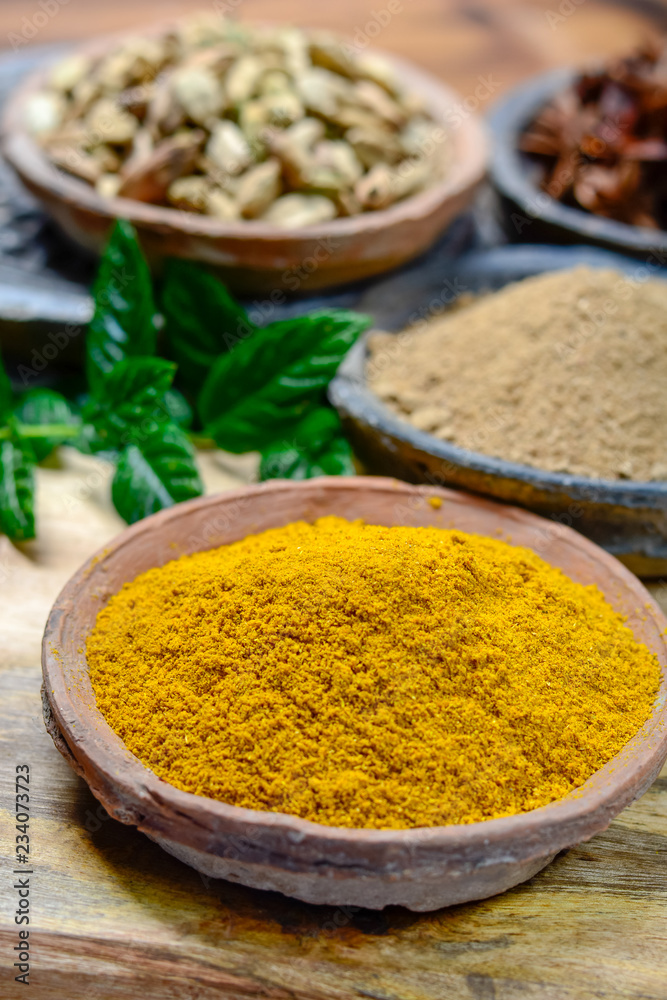 Old clay bowls wirh curry powder seeds close up, spices collection Old clay bowls wirh curry powder seeds close up, spices collection