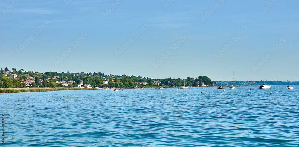 Fototapeta premium Lake Garda with nice walkways and beaches at Bardolino in Italy