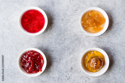 Assorted Variety of Jams and Marmalades;  Rose, Red Pepper, Mandarin and Citron Peel in Small Bowl.