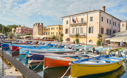 Harbor of city of "Bardolino" with colorful boats at Lake Garda in Italy
