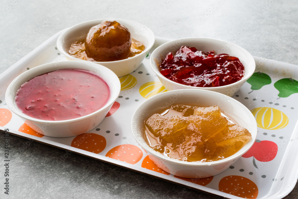 Assorted Variety of Jams and Marmalades; Rose, Red Pepper, Mandarin and Citron Peel in Small Bowl. Assorted Variety of Jams and Marmalades; Rose, Red Pepper, Mandarin and Citron Peel in Small Bowl.
